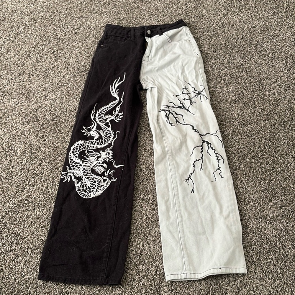 split color jeans with a dragon design and a lighting design on the other side!!